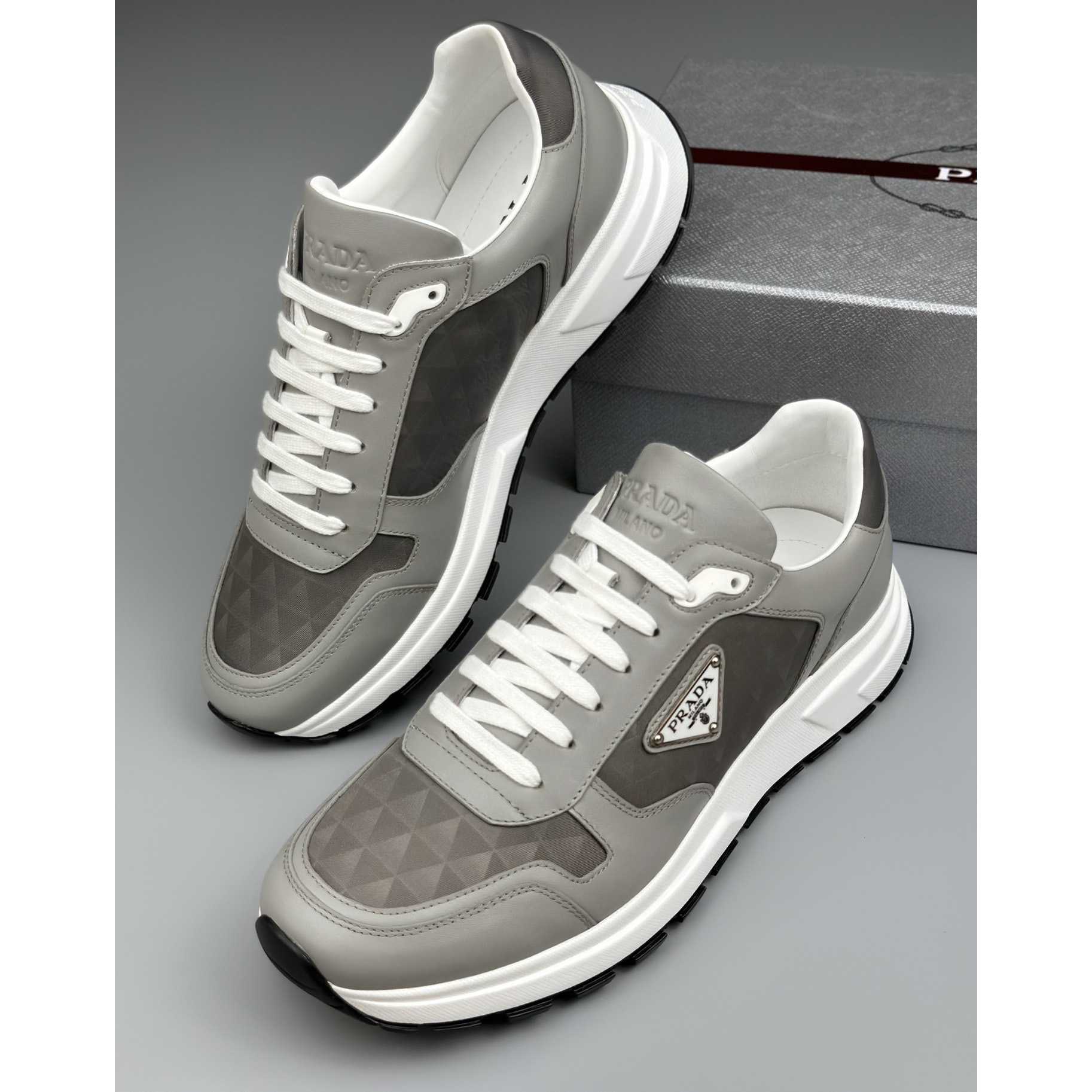 Prada Leather And Re-Nylon High-top Sneakers - 