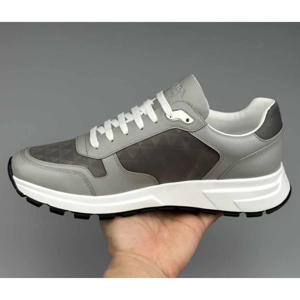 Prada Leather And Re-Nylon High-top Sneakers - 