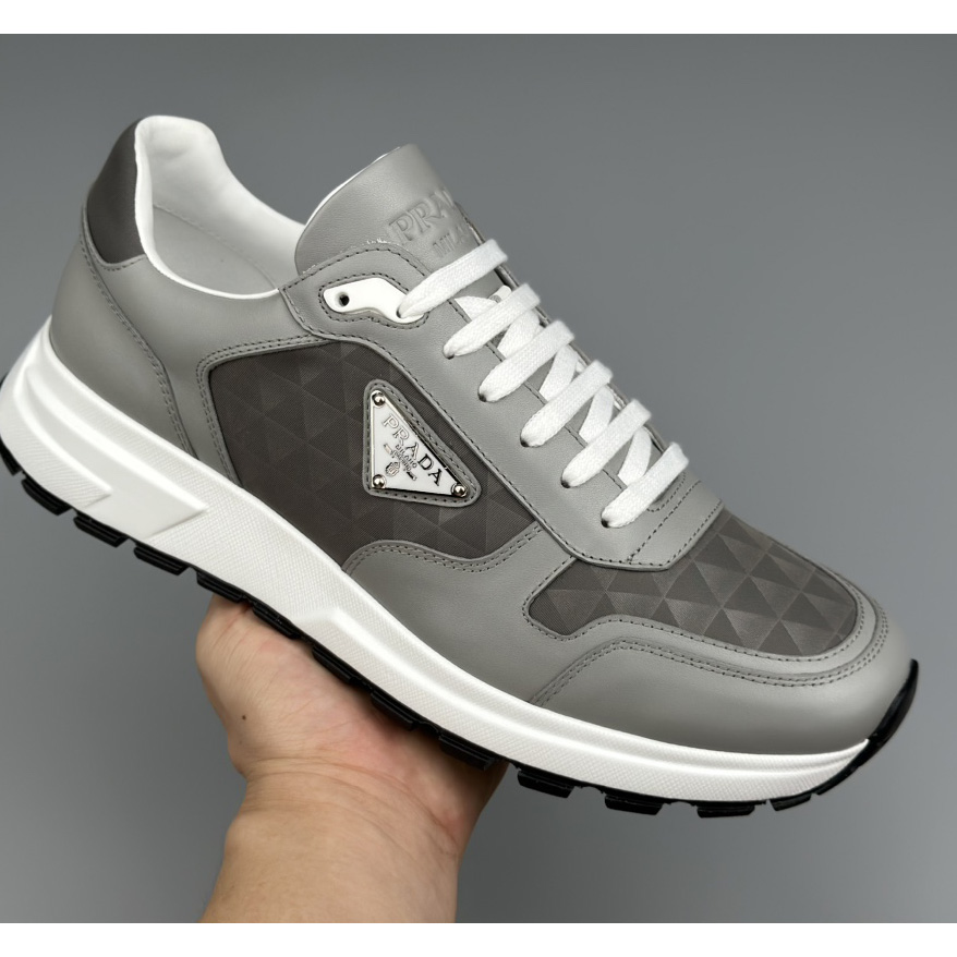 Prada Leather And Re-Nylon High-top Sneakers - 