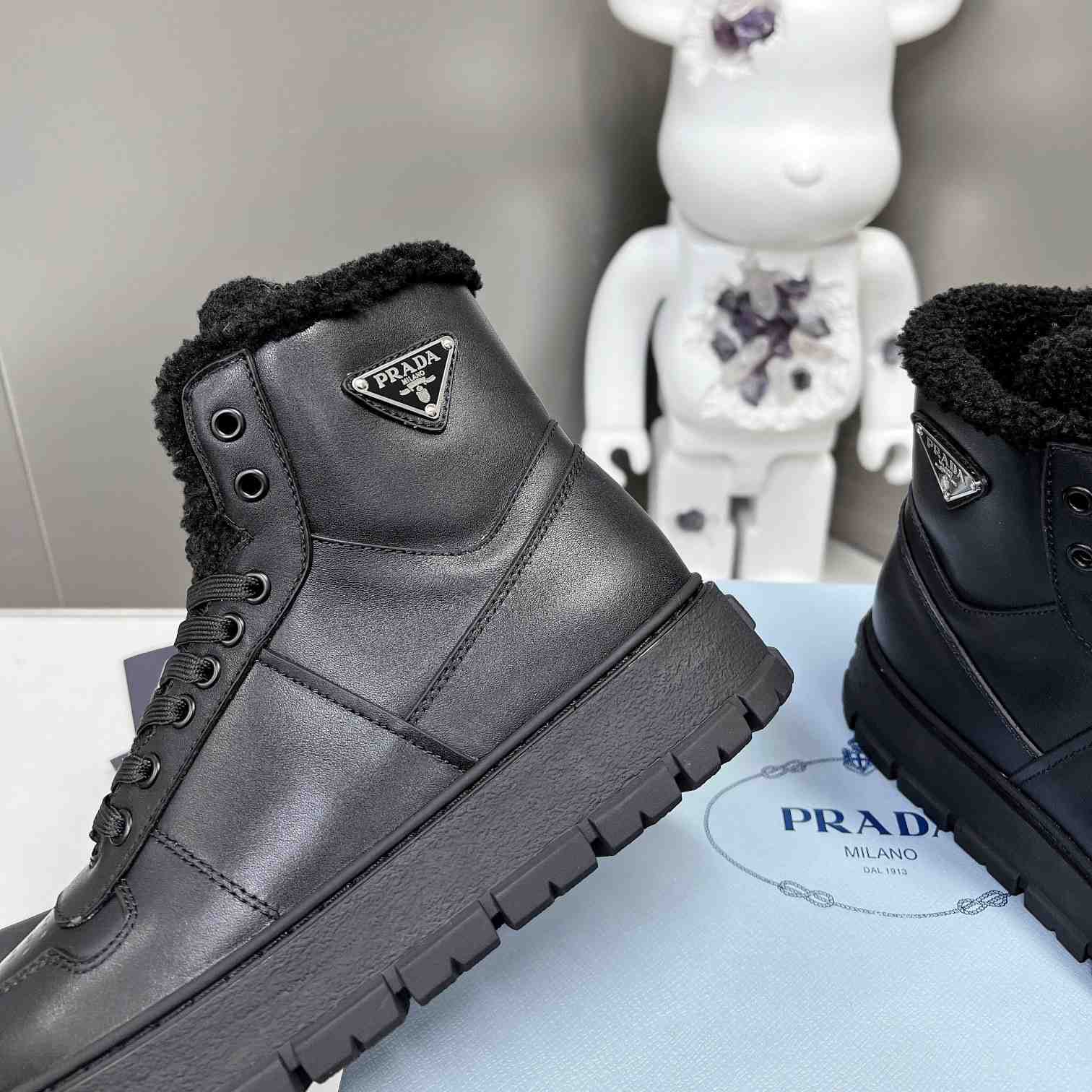Prada Leather And Shearling High-top Sneakers - PerfectKickZ