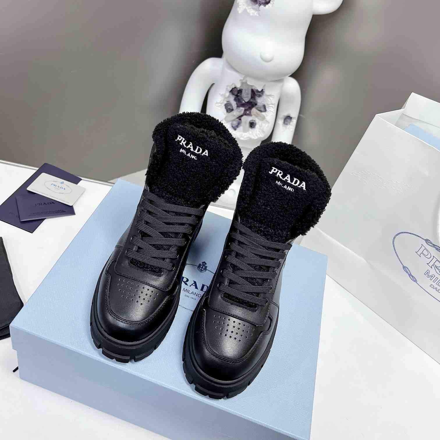 Prada Leather And Shearling High-top Sneakers - 