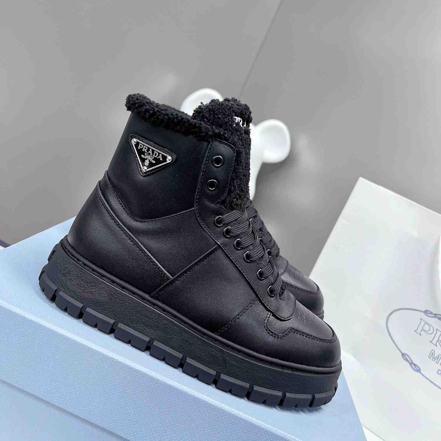 Prada Leather And Shearling High-top Sneakers - PerfectKickZ