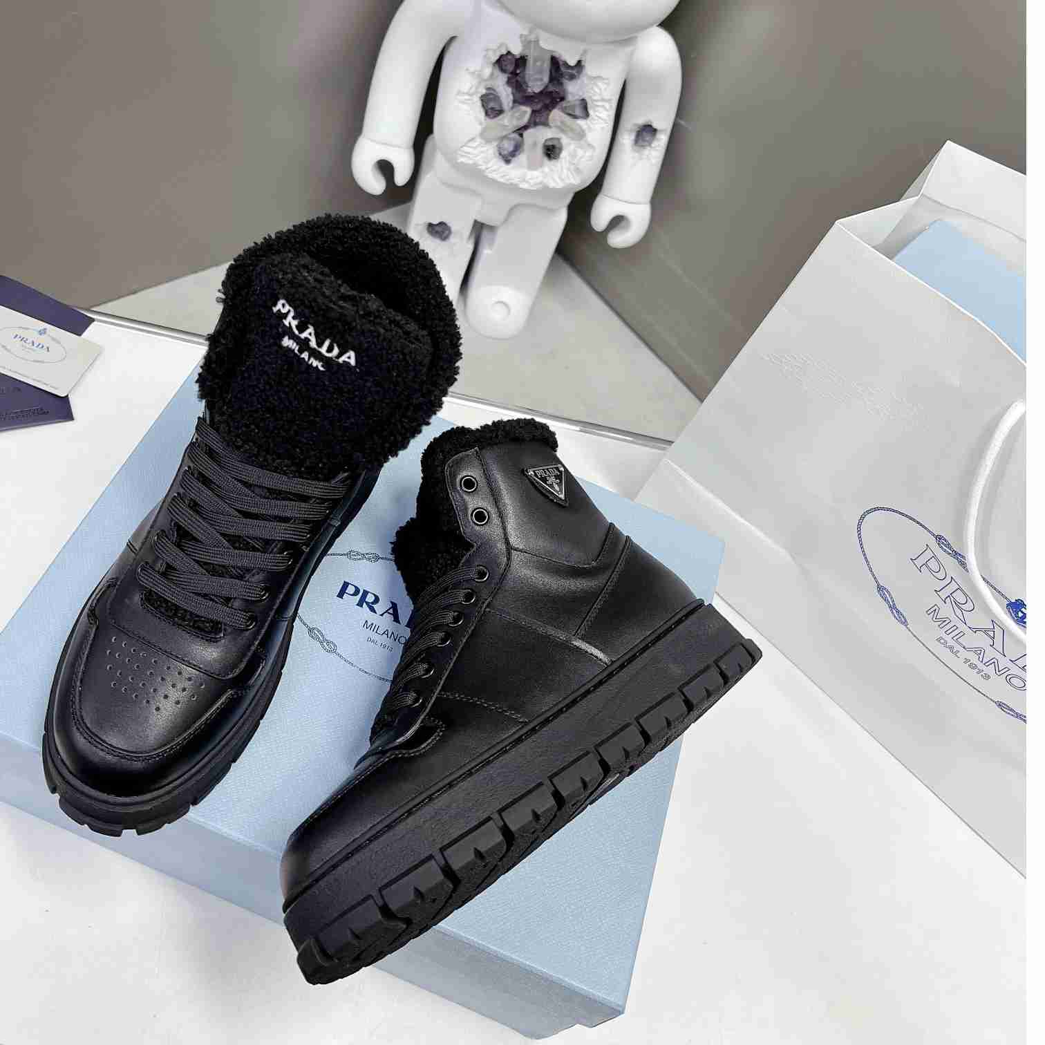 Prada Leather And Shearling High-top Sneakers - 