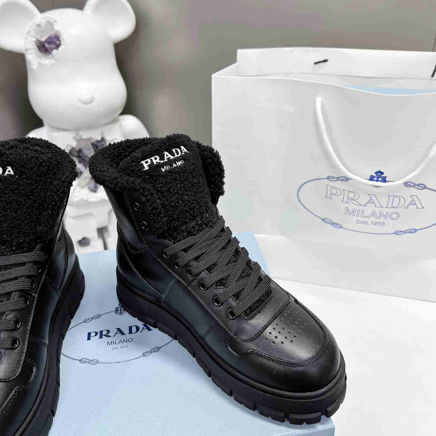 Prada Leather And Shearling High-top Sneakers - 