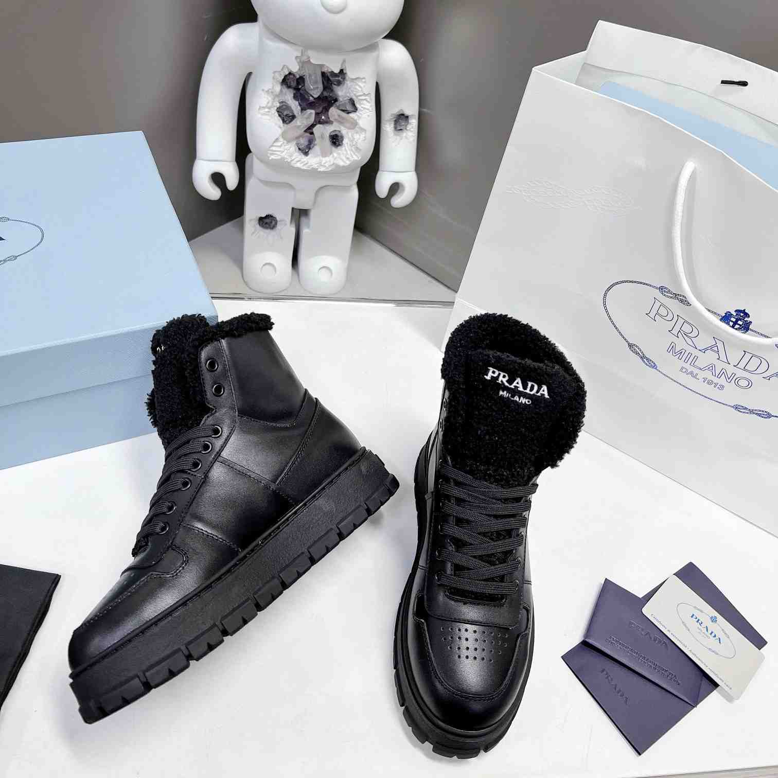 Prada Leather And Shearling High-top Sneakers - 