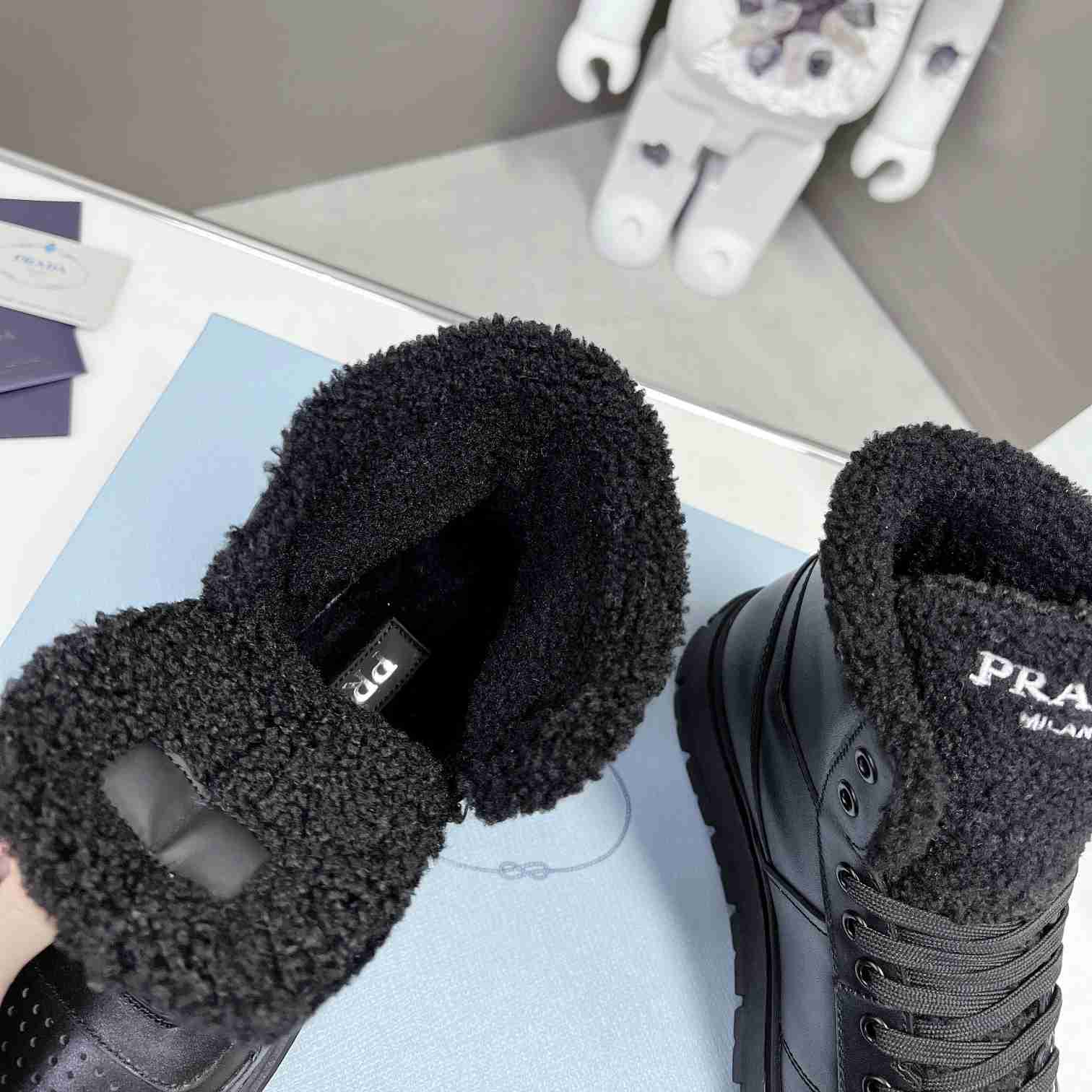 Prada Leather And Shearling High-top Sneakers - 