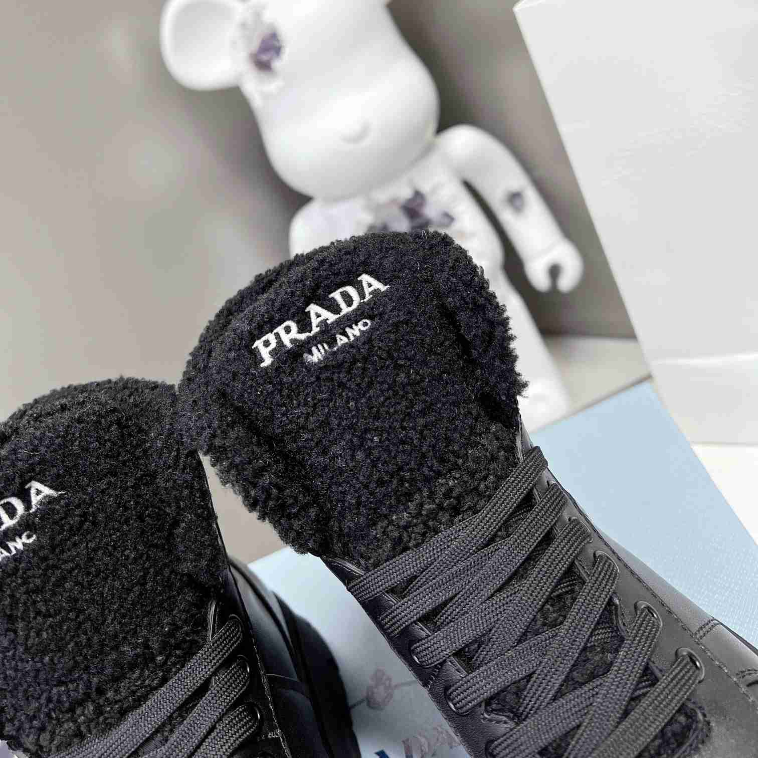 Prada Leather And Shearling High-top Sneakers - 