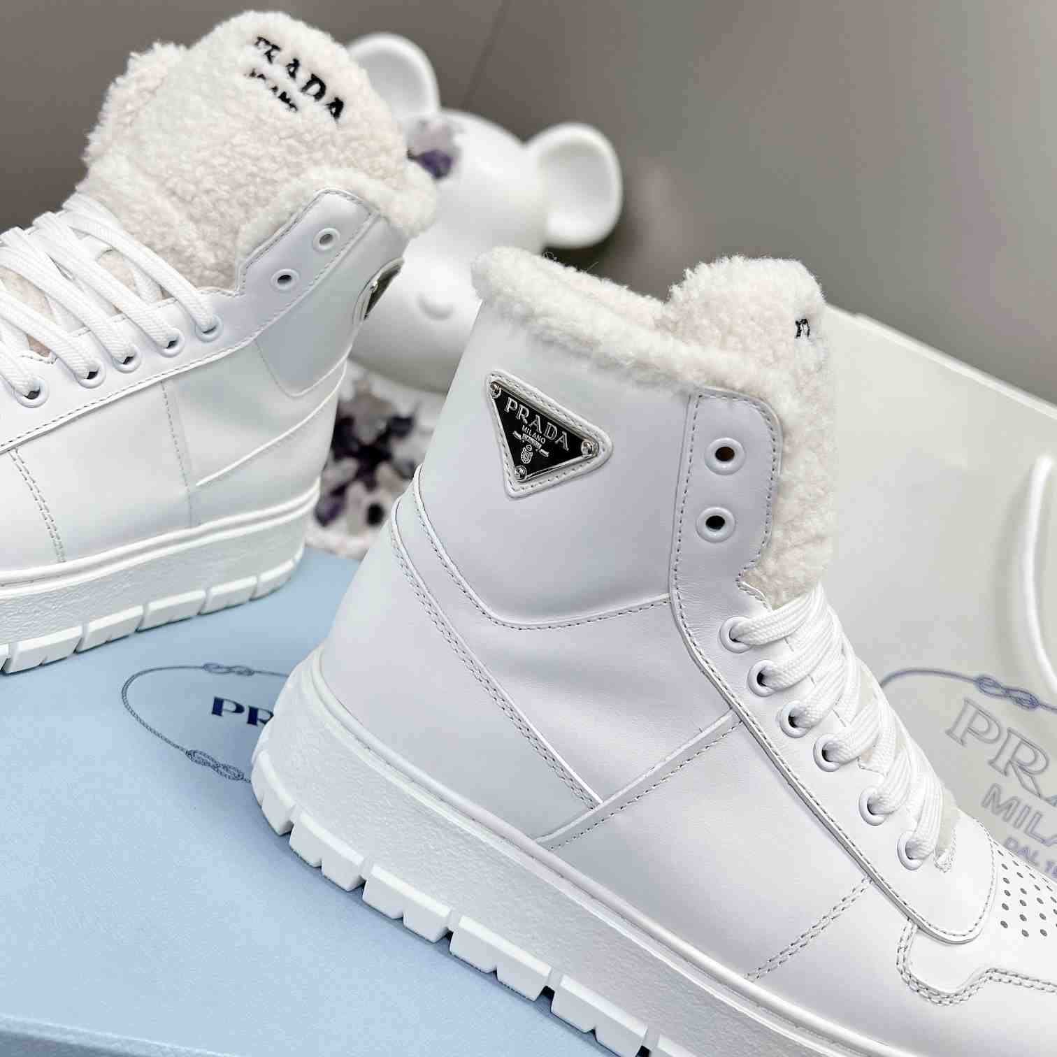 Prada Leather And Shearling High-top Sneakers - PerfectKickZ