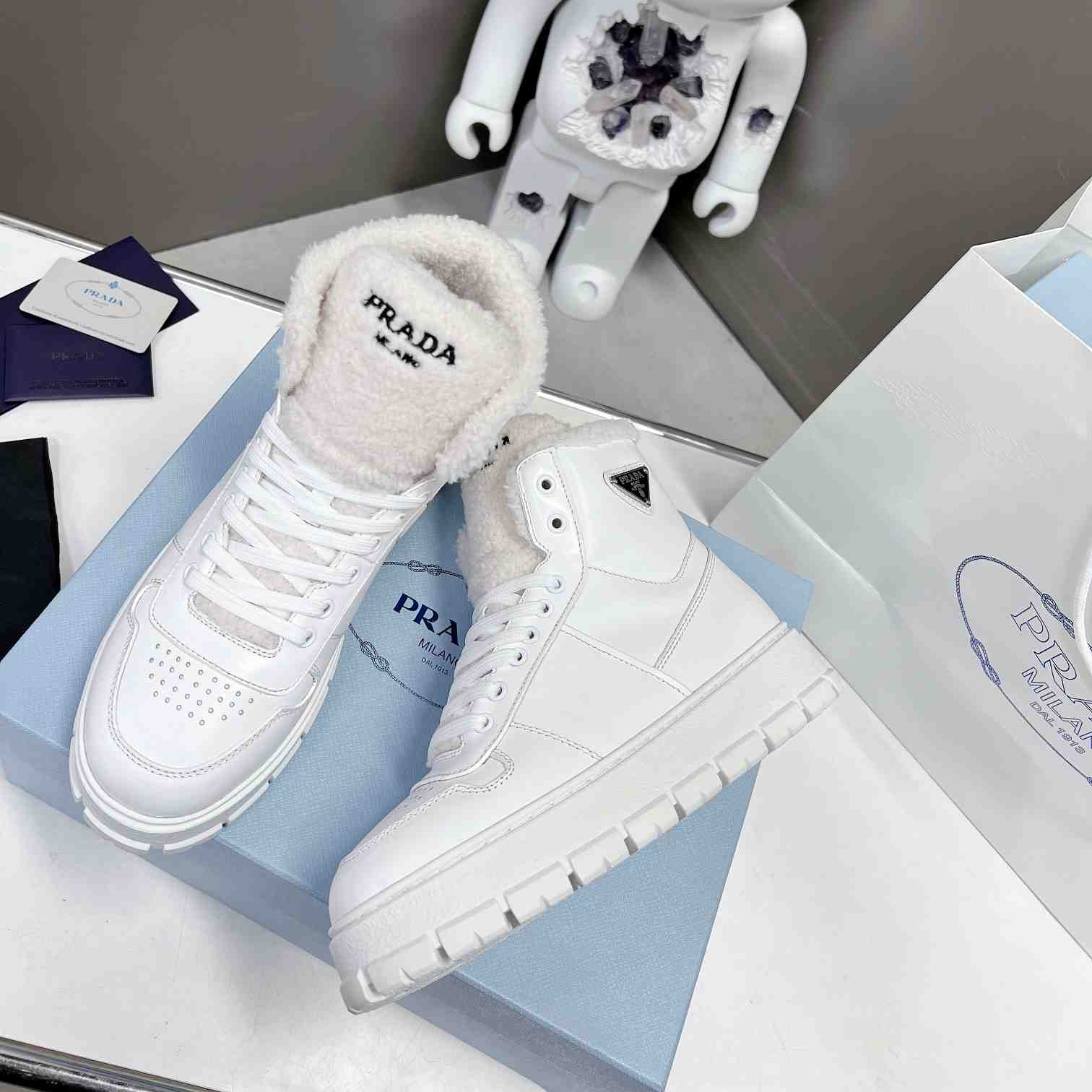 Prada Leather And Shearling High-top Sneakers - PerfectKickZ