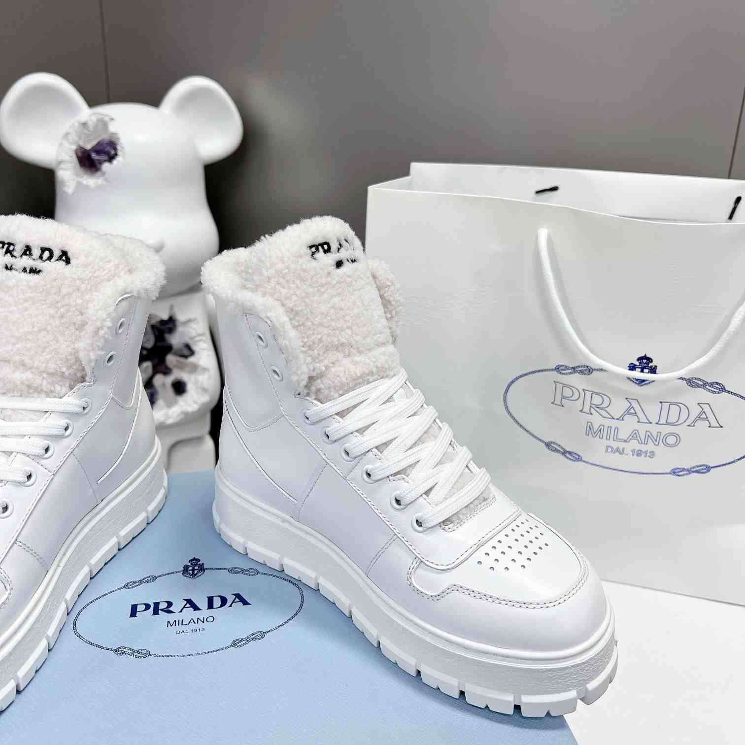 Prada Leather And Shearling High-top Sneakers - PerfectKickZ