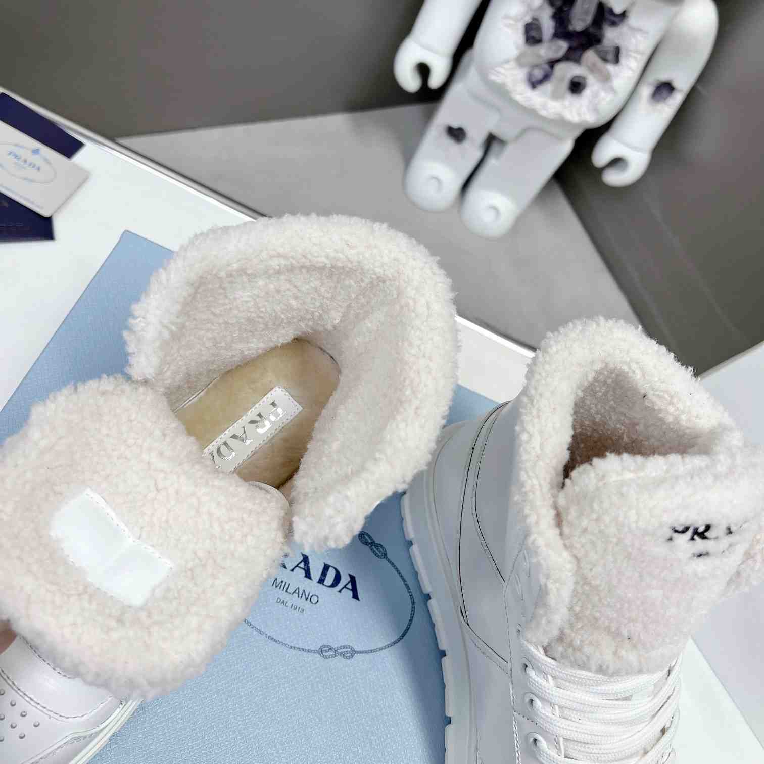 Prada Leather And Shearling High-top Sneakers - PerfectKickZ