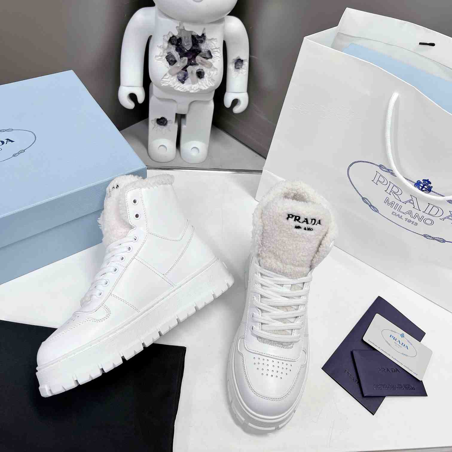 Prada Leather And Shearling High-top Sneakers - PerfectKickZ