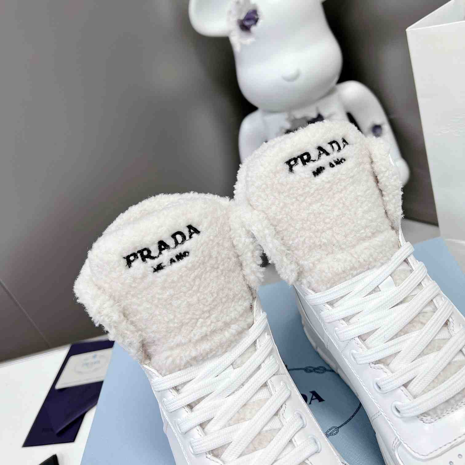 Prada Leather And Shearling High-top Sneakers - PerfectKickZ