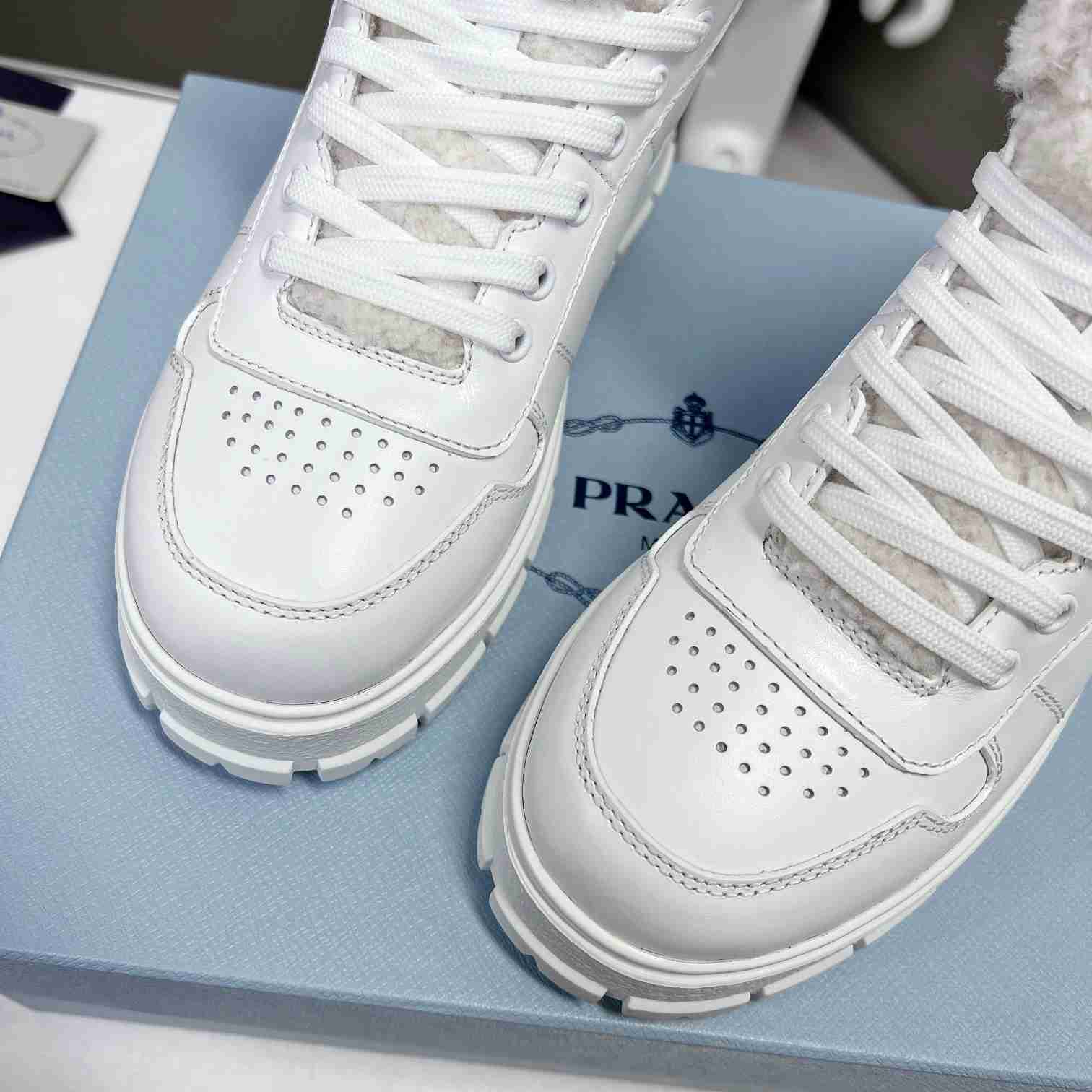 Prada Leather And Shearling High-top Sneakers - PerfectKickZ